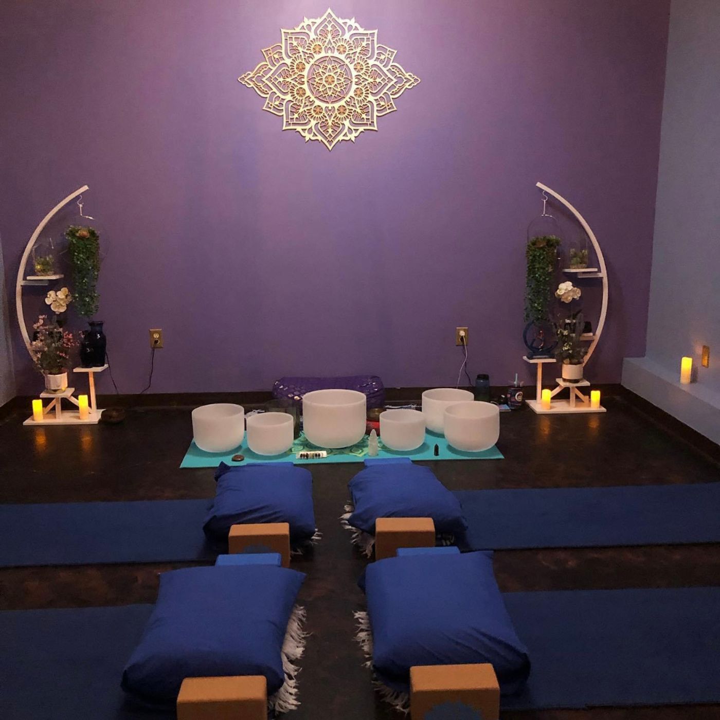 The yoga room at The Retreat by Bliss, mats laid out under the mandala
